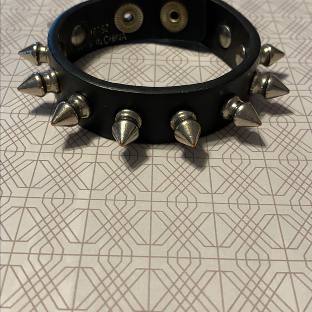 Black faux leather bracelet with silver spikes